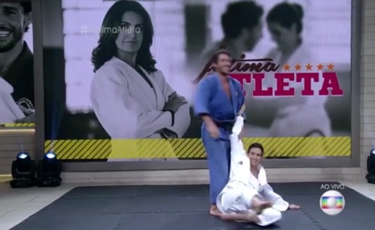 Fátima Bernardes leva golpe de judô de Flávio Canto e cai no Encontro