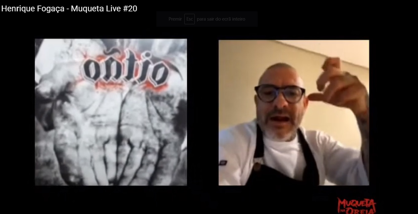 Henrique Fogaça durante live no YouTube; ao laod capa do seu CD