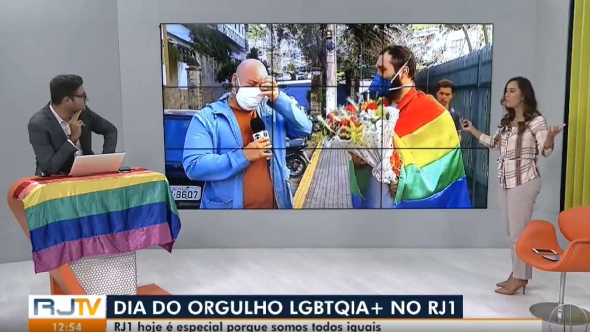 Ádison Ramos e o marido no RJ1 (Reprodução/Globo)